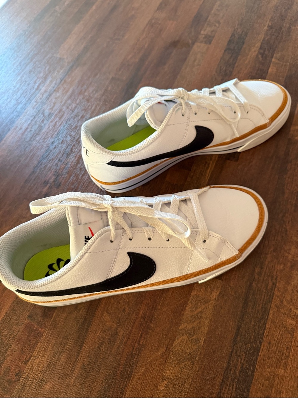 Nike Women’s White Sneakers with Black Swoosh and Tan Accents